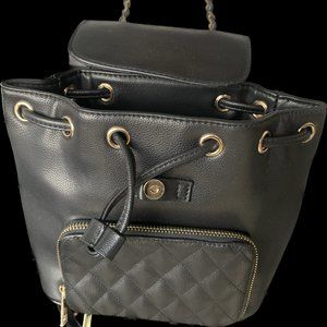 black handbag with gold compliments